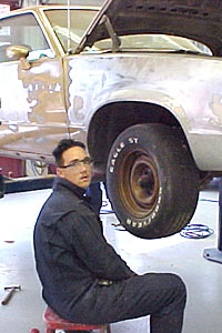 students works on the front quarter panel.